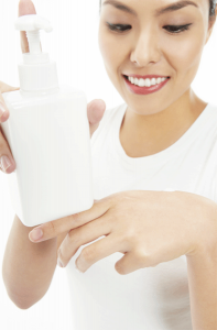 woman applying skin lightening cream